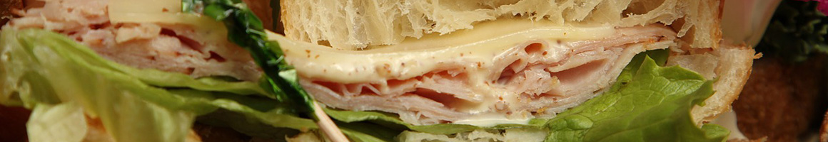Eating Deli Sandwich at Pickle Haus Deli restaurant in Northborough, MA.